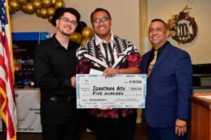 Valdez tutor/mentor Toni Atieh, student Ionatauna Asu, and Valdez Educational Services CEO Aaron Valdez holding a $500 scholarship check